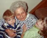 [Photo: Titia with grandchildren Kees and Helena]